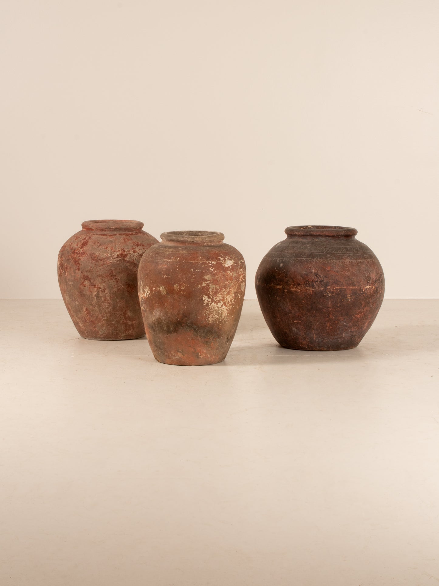 Set of three Asian water pots
