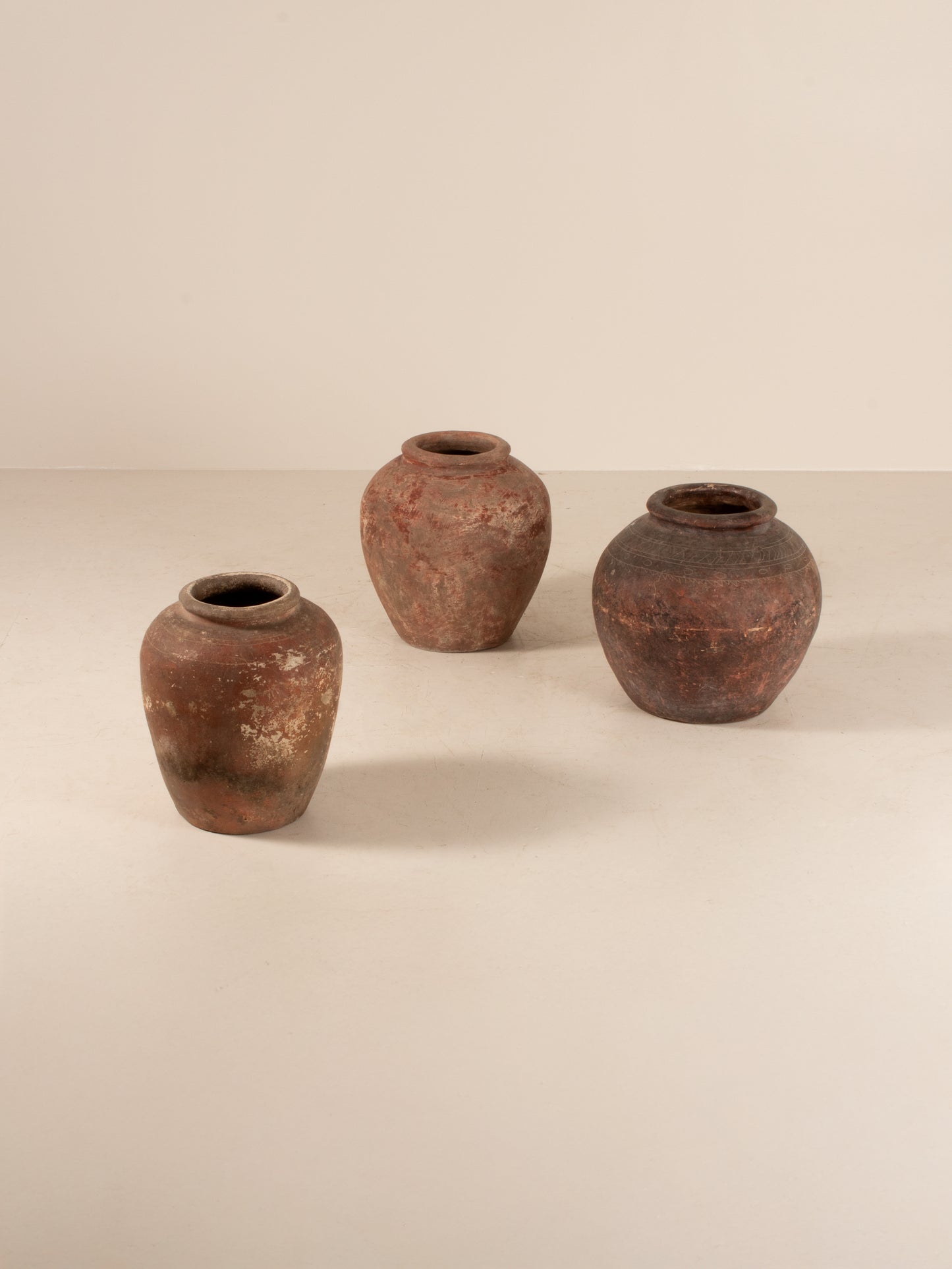 Set of three Asian water pots