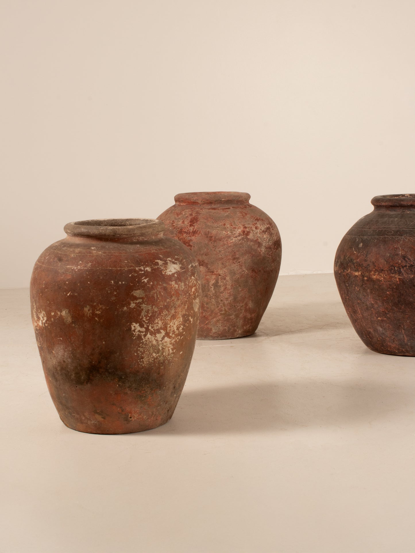 Set of three Asian water pots