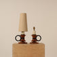 Pair circular handle table lamps, ebonized wooden rings